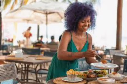 Woman enjoying outdoor dining in Lisbon Portugal - savoring authentic Portuguese cuisine on the Enticing Douro soulful cruise experience